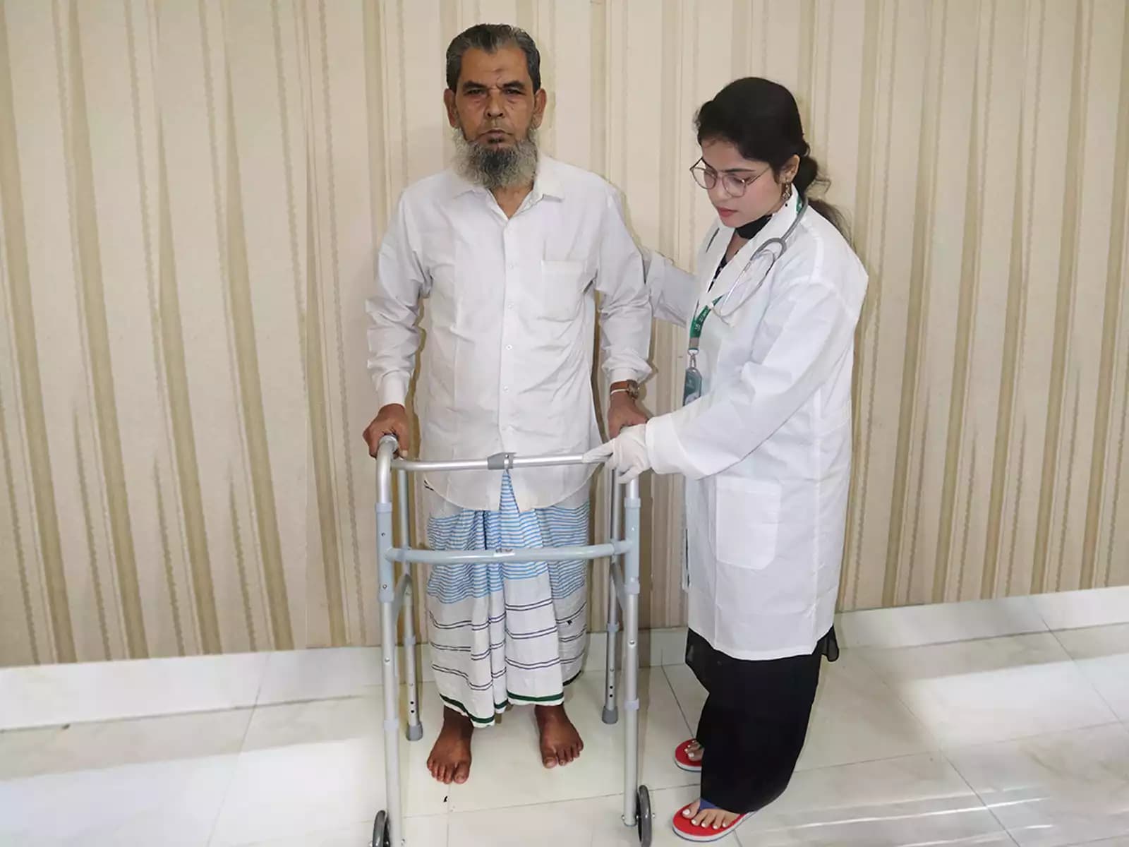 Caregiver Service — a trained attendant sitting with an elderly man at home